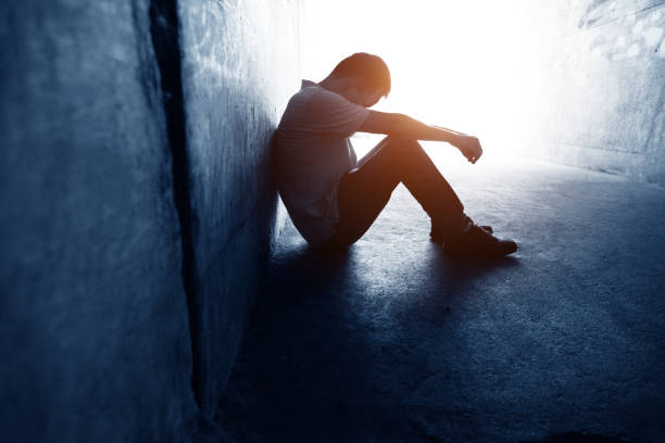 istock Desperate man sitting in the tunnel 1177437738