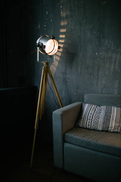 istock Sofa in dark room interior lit by light equipment 1177437937