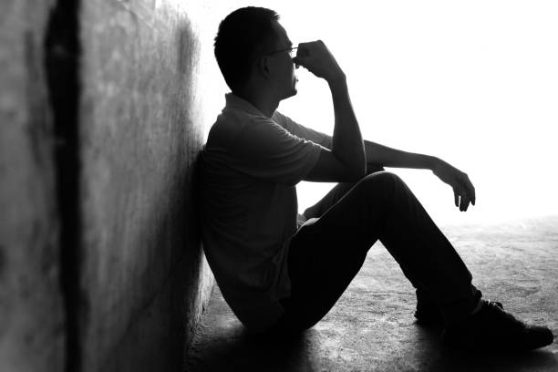 istock Desperate man sitting in the tunnel 1177438126