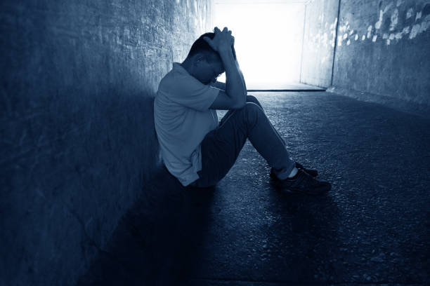istock Desperate man sitting in the tunnel 1177438275