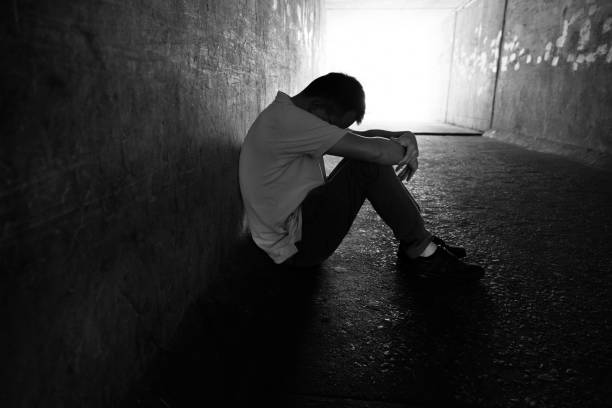 istock Desperate man sitting in the tunnel 1177438375