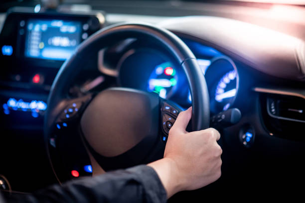 istock Driver hand holding steering wheel in the car 1177438408