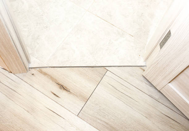 istock Installation of threshold indoors. Renovation works in the flat. 1177439887