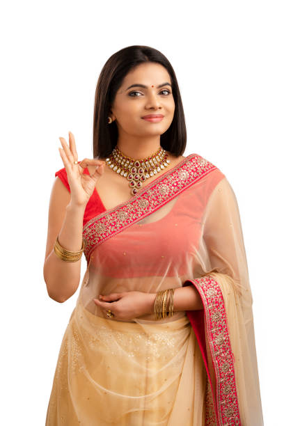 Pretty Indian young girl showing best hand sign. Pretty Indian young Muslim girl showing best hand sign. beautiful traditional indian girl stock pictures, royalty-free photos & images
