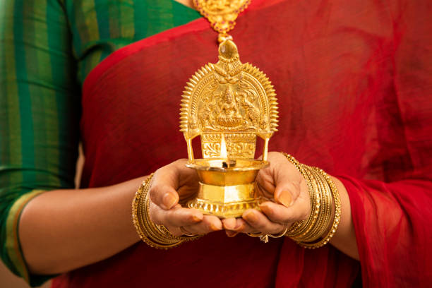 istock Hindu Indian young women holding Deepam in hands. 1177440008