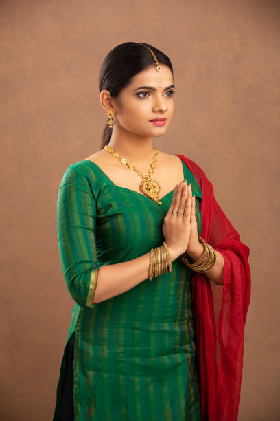 istock Pretty Indian young woman praying 1177440078