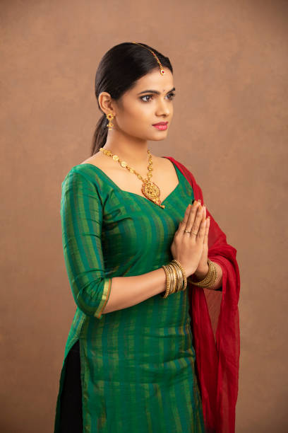 istock Pretty Indian young woman praying 1177440094
