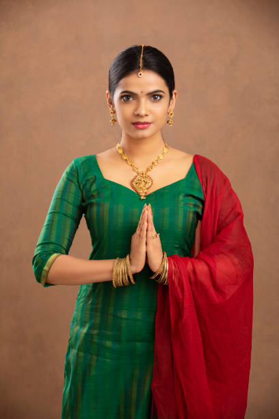 istock Pretty Indian young woman praying 1177440108