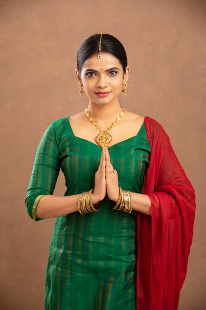 istock Pretty Indian young woman praying 1177440110