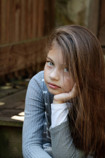istock Beautiful Young Girl Sitting on Steps 1177442080