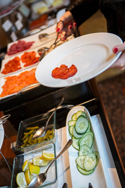 istock Woman choosing food at buffet 1177442640