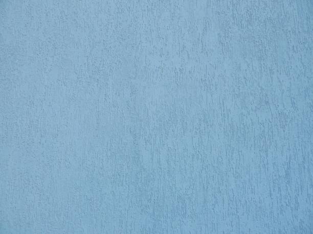 istock Beautiful light blue background. Blue wall of a building close-up. Decorative plaster. 1177442693