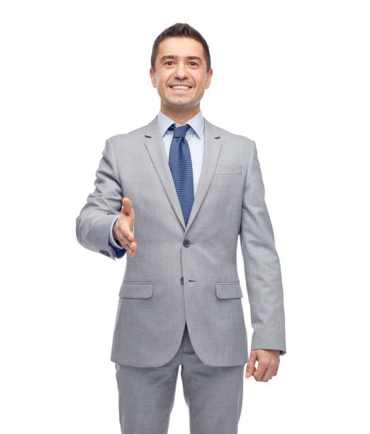 istock happy smiling businessman in suit shaking hand 1177443807