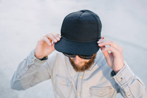 istock Hipster handsome male model with beard wearing black blank baseball cap with space for your logo 1177443867
