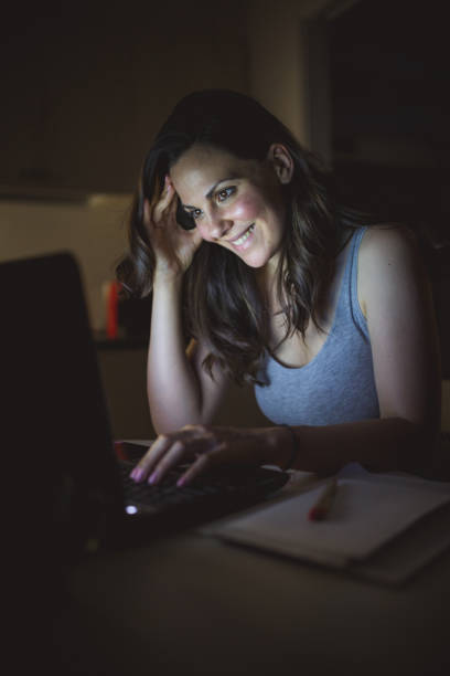 istock Woman working late at home 1177443971