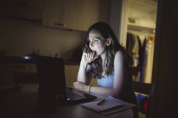 istock Woman working late at home 1177444002
