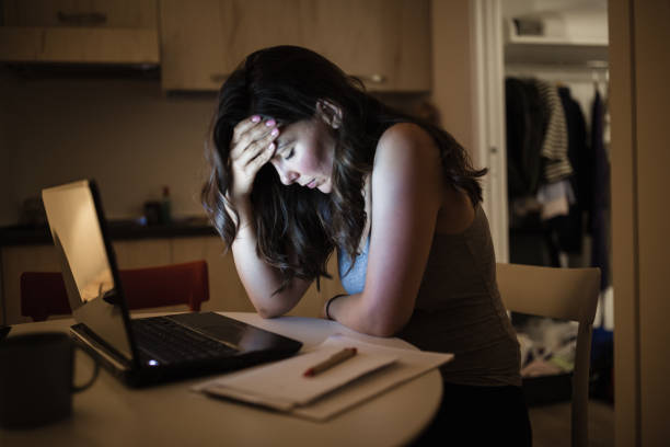 istock Woman working late at home 1177444028
