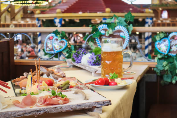 Beer Fest Beer Hall table with Food Beer Fest Beer Hall table with Food oktoberfest food stock pictures, royalty-free photos & images