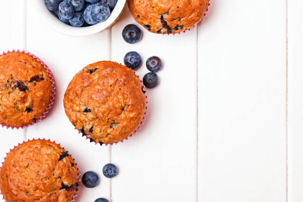 istock Delicious muffins with blueberries on the white wooden table 1177449126