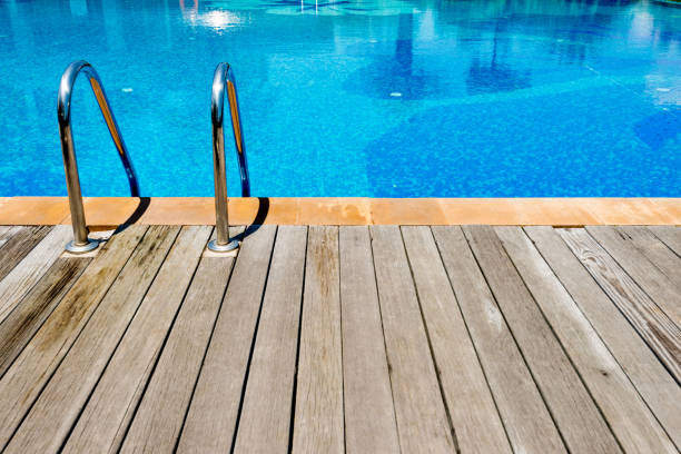 istock Swimming pool with metal ladder 1177450989