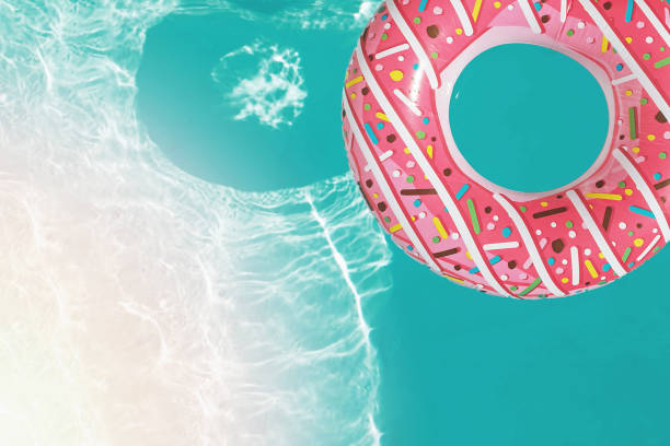 istock Inflatable ring of donut shape floating in the swimming pool, 1177451089