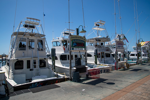 Sport Fishing Boats in dock at Destin Florida. Destin is a popular destination for sport fishermen from around the world with dozens of charter fishing boats available for hire.\nDestin, Florida\nSeptember 22, 2019