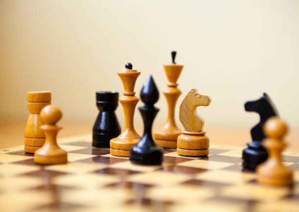 chess pieces on the chessboard. - checking the time imagens e fotografias de stock