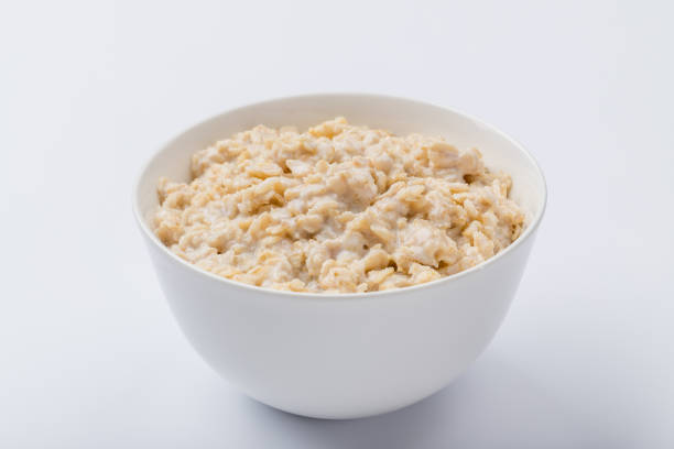 istock porridge oatmeal on white background NOT isolated 1177454106