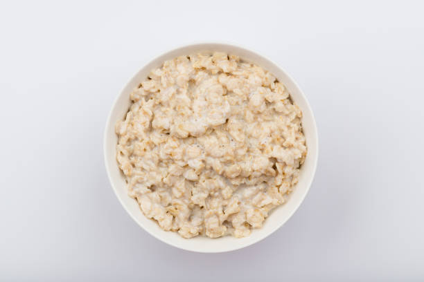 istock porridge oatmeal on white background NOT isolated 1177454155