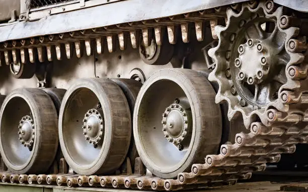 Photo of Closeup of green caterpillar track of the tank or Buk missile system standing.