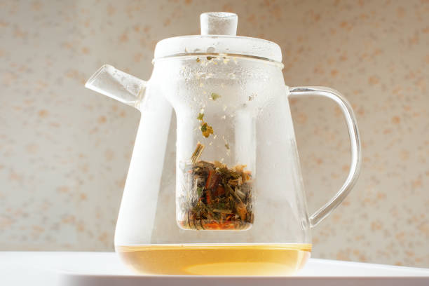istock Transparent teapot with tea rest and herbs 1177456747