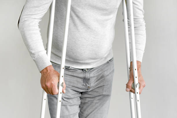 istock Elderly man with crutch. Close-up. Side view 1177456912