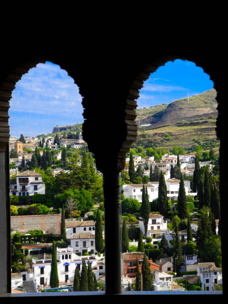Windows view of Granada town (city). Carved windows, Alhambra palace.