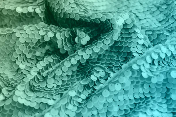 istock Mint green shiny fabric with sequins, abstract background. 1177462518