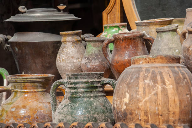Clay vase displayed on a stone wall shelf
