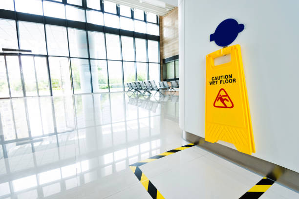 istock Wet floor sign hanging on the wall 1177467577