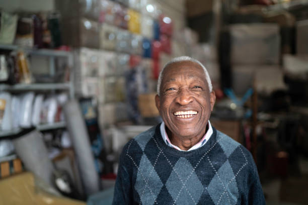 Portrait of a senior man standing in an upholstery workshop Portrait of a senior man standing in an upholstery workshop one senior man only stock pictures, royalty-free photos & images