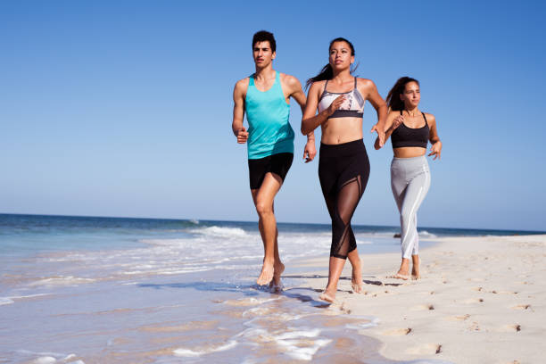 istock Young woman winning the beach reac 1177471479