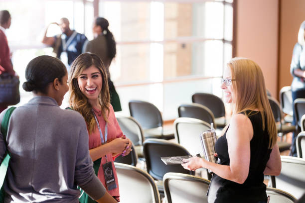 istock Three female friends meet up before expo begins 1177480888