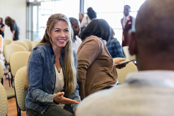 istock While speaking with unrecognizable man, woman gestures and smiles 1177480961