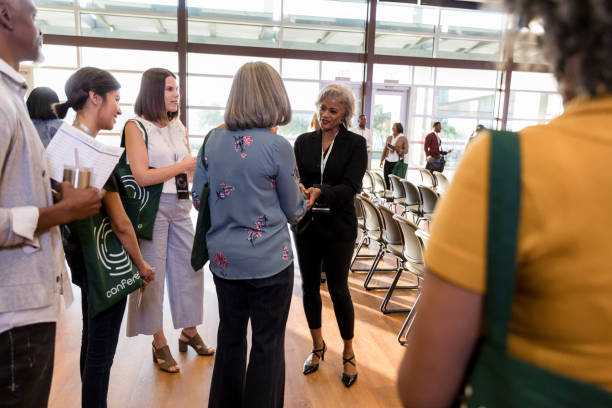 istock Speaker shakes hands with diverse people attending expo 1177480991