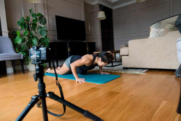 istock Pregnant vlogger demonstrates exercise 1177481124