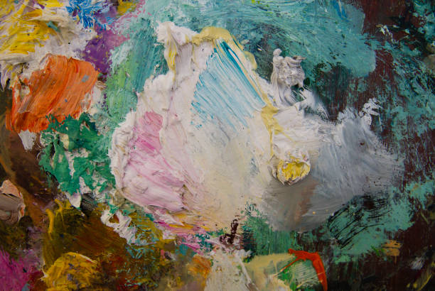 Artist painting art, selective focus close-up on palette