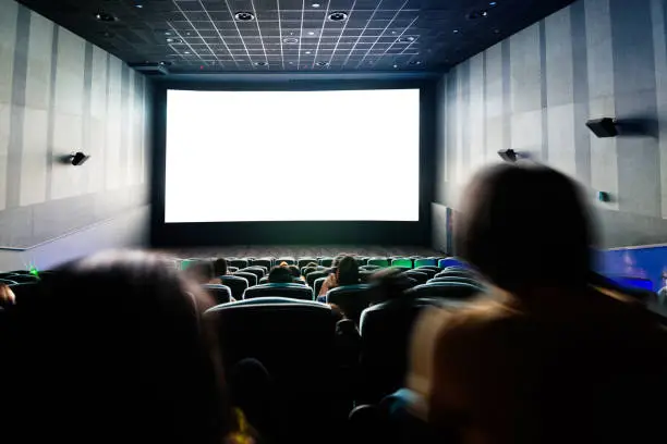 Photo of Rear view of people at the cinema