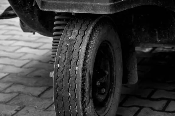 Photo of black and white shot of rubber tire.