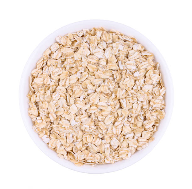 istock The white plate with uncooked oatmeal. 1177485335