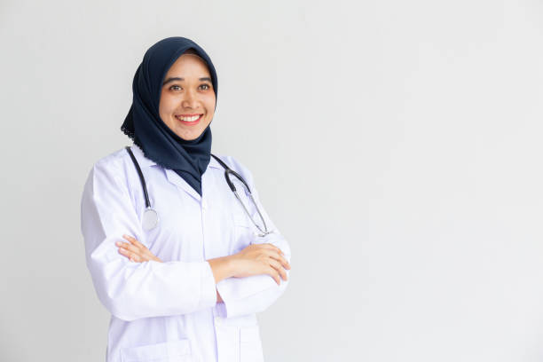 istock Young Arab Muslim intern doctor women smile on isolate white background concept for Islam people working in medical hospital health care, Modern Nurse wearing hijab in medico clinic business service. 1177485514