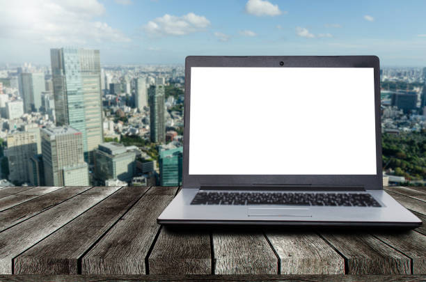 istock laptop notebook computer with white blank screen on desk with during sunrise and cityscape background, advertisement, workspace, internet technology, online social media and searching data concept 1177487063