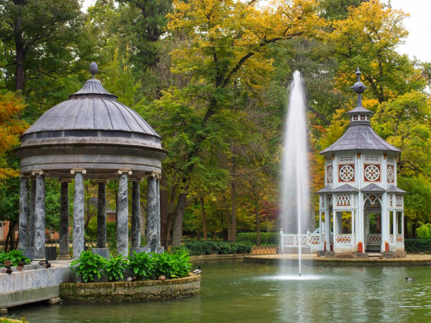 Autumn scene Pond of the Chinescos Aranjuez, Madrid, Spain- November 6, 2018: The Pond of the Chinescos is an artificial lake, a Greek-style temple, a Chinese-style temple and an Egyptian granite mausoleum. aranjuez stock pictures, royalty-free photos & images