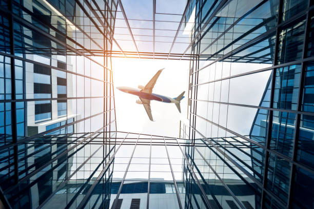 istock Airplane flying over skyscrapers in the city 1177488237